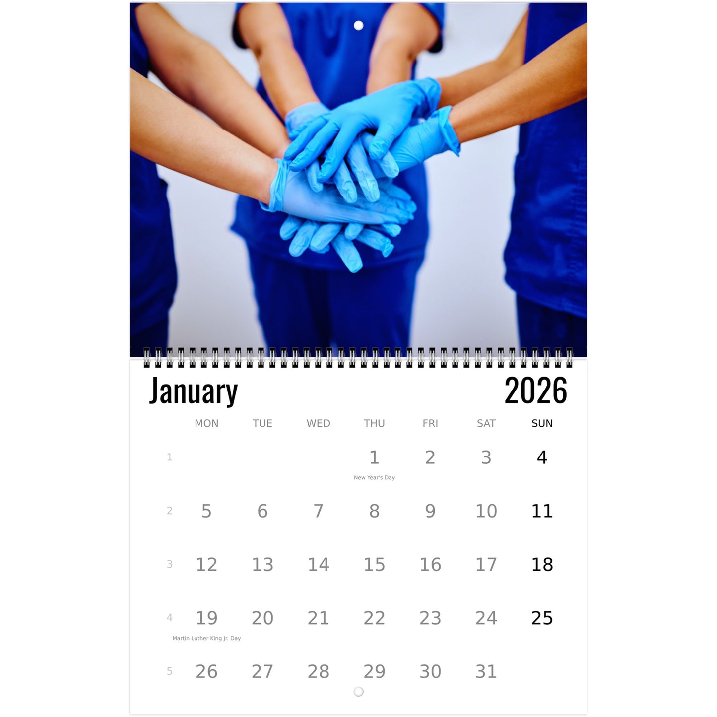 Calendar for January 2026 showing hands in blue gloves stacked together, with a person wearing a blue scrub top.