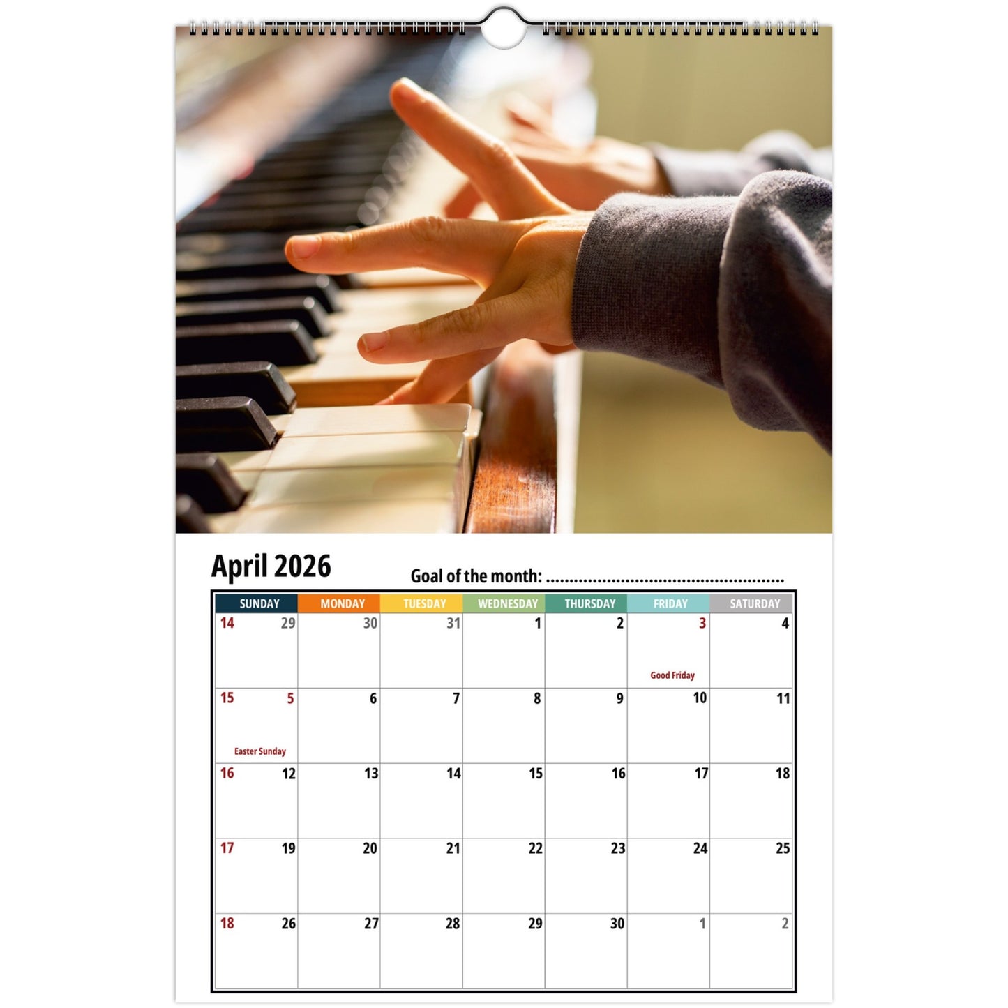 Calendar page for April 2026 with a hand on piano keys
