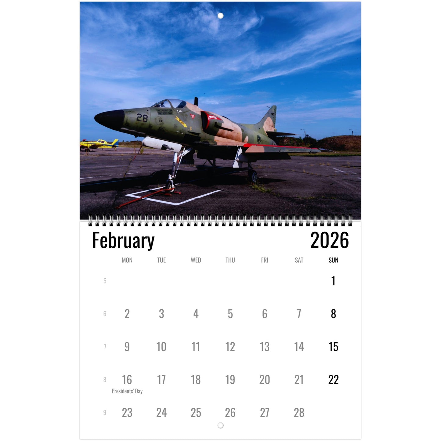 Calendar page for February 2026 featuring a military aircraft on an airfield.