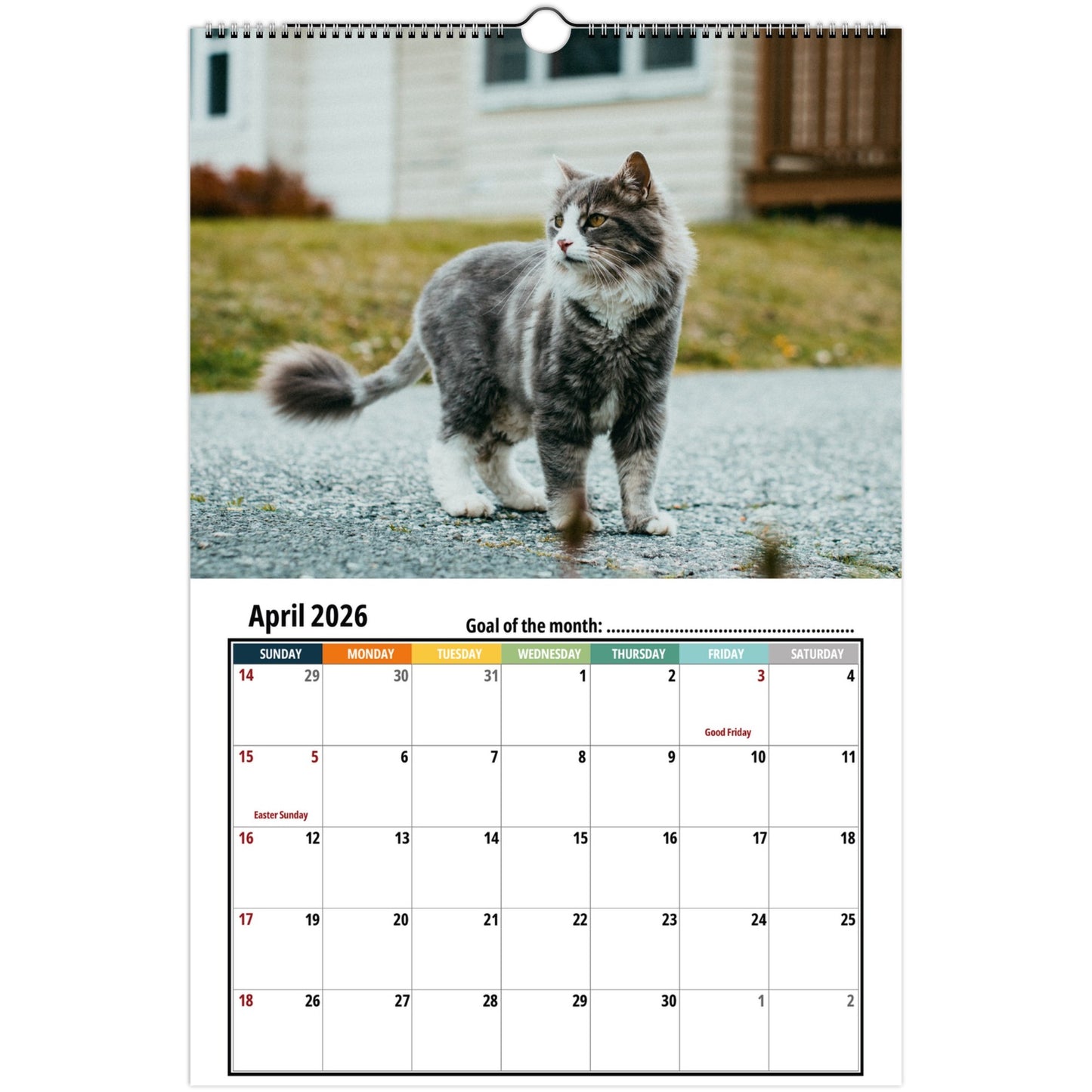 Calendar with a cat on a road in front of a house, April 2026 displayed.