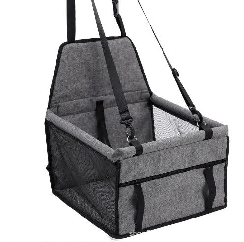Gray pet car seat with straps on a white background