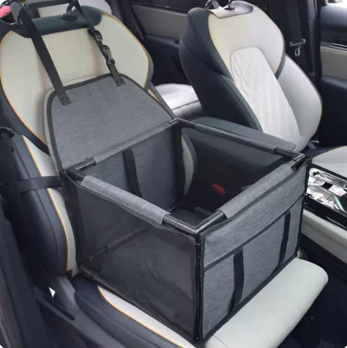 Pet seat cover in a car with open lid